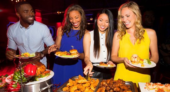 Coworkers enjoying a buffet